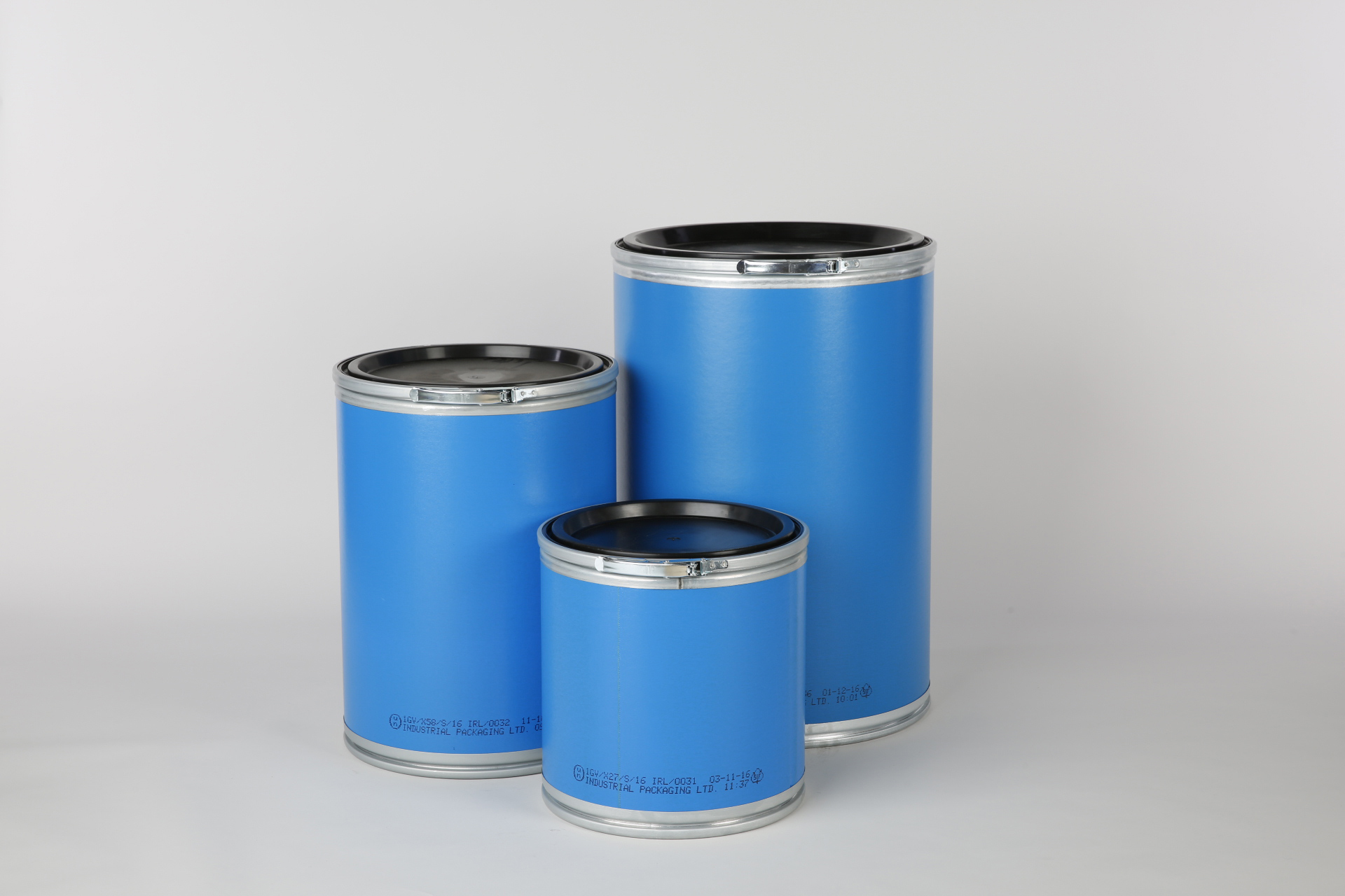 Three blue fibre drums of different sizes